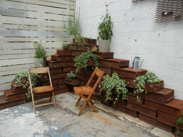 Gotta love those rusting planters made from metal drawers.